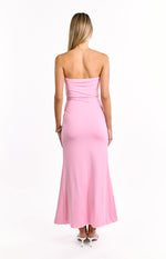 Rear view of the pink strapless maxi dress, showing the fitted bodice and a gentle flare in the skirt