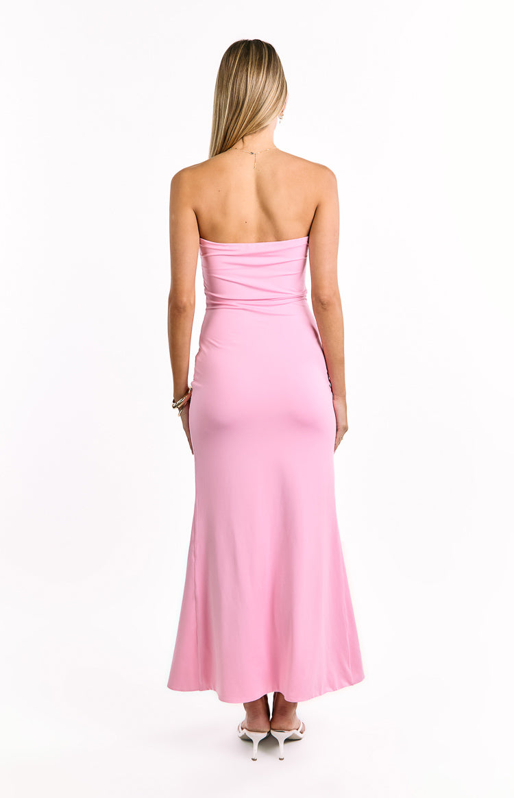 Rear view of the pink strapless maxi dress, showing the fitted bodice and a gentle flare in the skirt