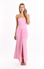 Pink strapless maxi dress with a straight neckline, ruched waist detail, and a high front slit