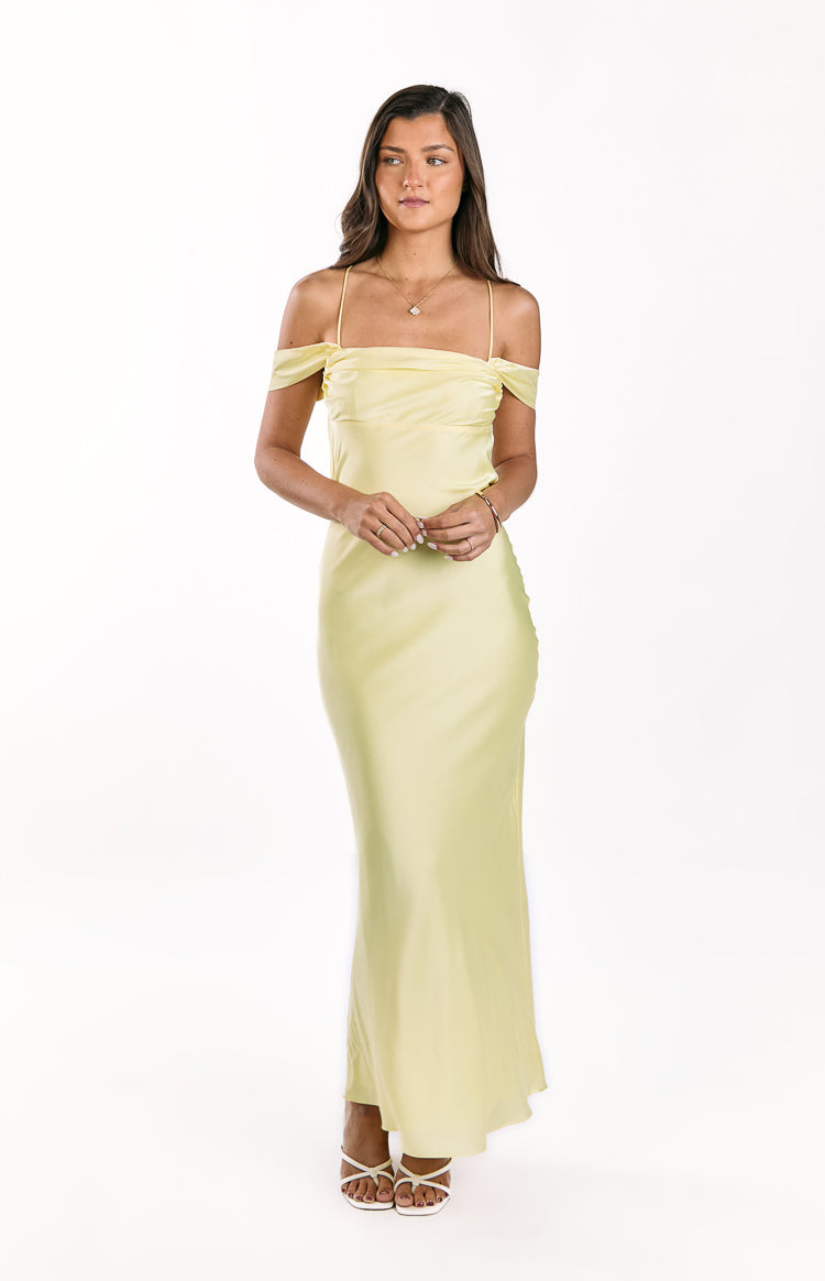 Front view of a light yellow satin maxi dress with off-shoulder tie sleeves and delicate spaghetti straps