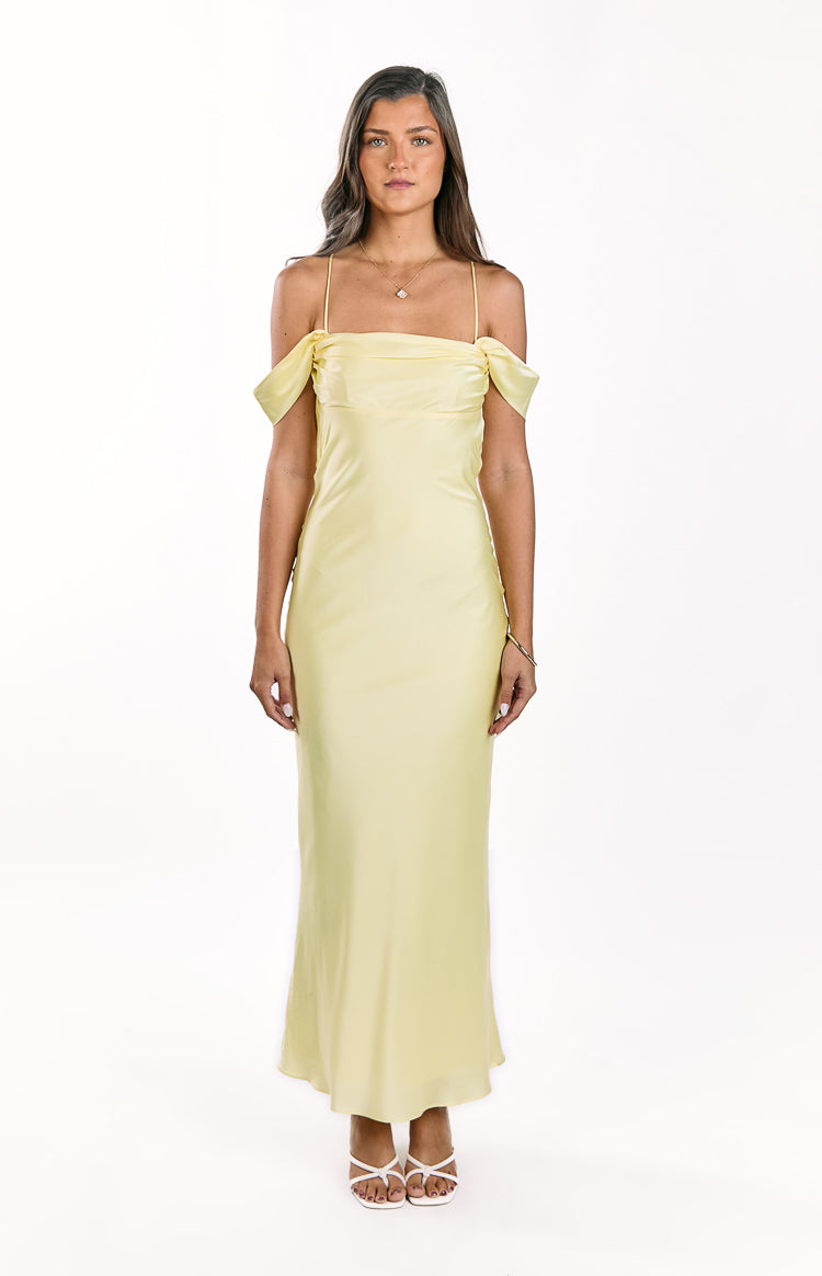 Light yellow satin maxi dress with delicate spaghetti straps and tie off-shoulder sleeves