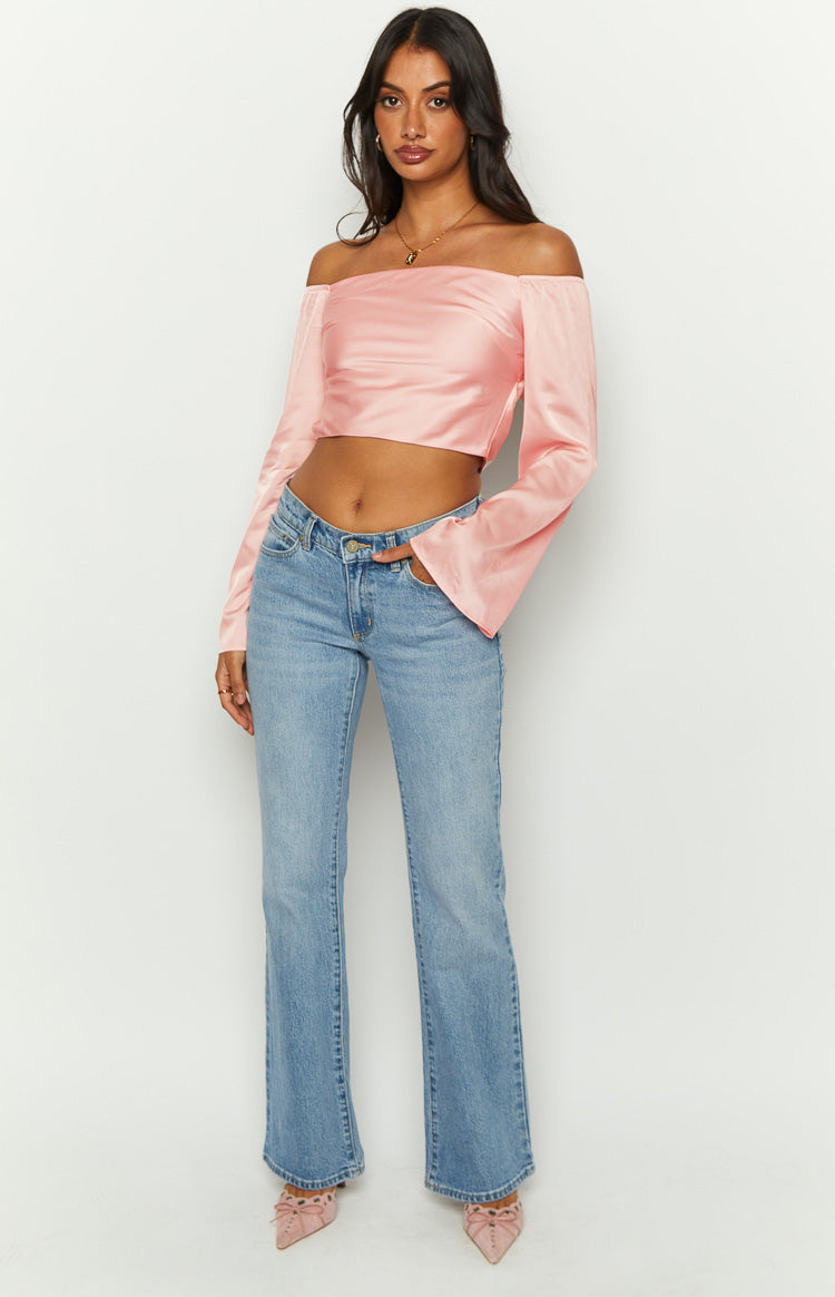 Front view of a pink satin off-shoulder crop top with long bell sleeves
