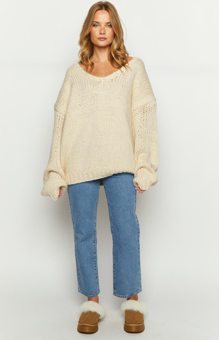 Cream chunky knit oversized sweater with a relaxed V-neck and long loose sleeves
