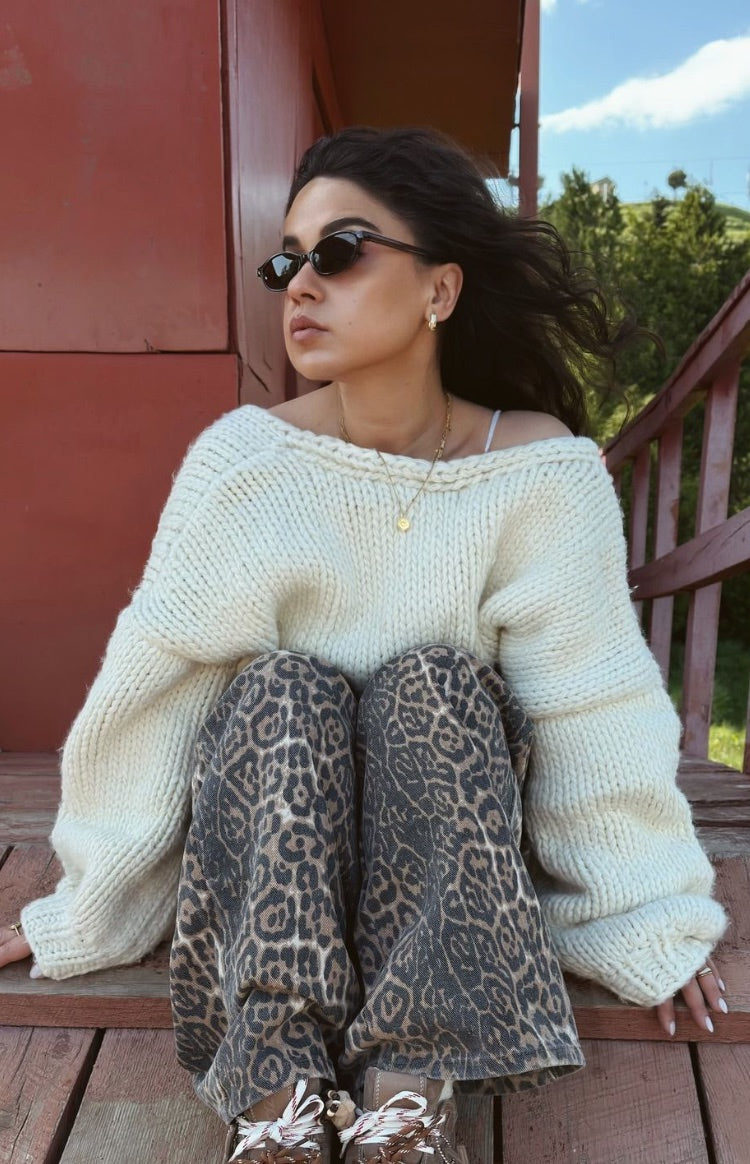 Brunet leopard print straight leg jeans with dark brown and grey spots, gathered at the knees