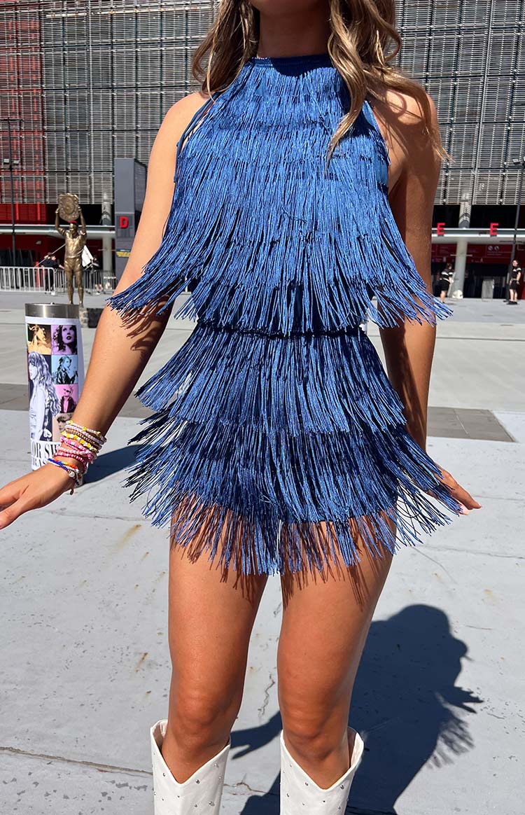 Side view of the blue tassel playsuit with multiple tiers of flowing fringe