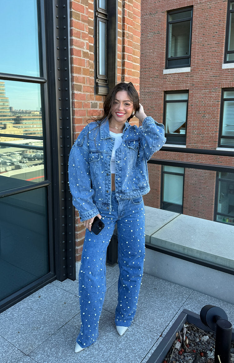 Mid wash denim jacket with all-over pearl embellishments and a relaxed, slightly oversized fit