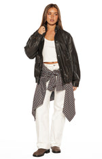 Brown plaid button up long sleeve shirt tied around the waist
