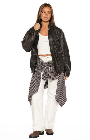 Brown plaid button up long sleeve shirt tied around the waist