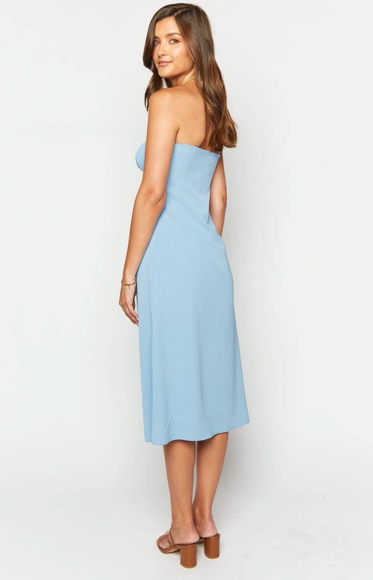 Side view of a light blue strapless midi dress, showing the fitted bodice and the flowing A-line skirt