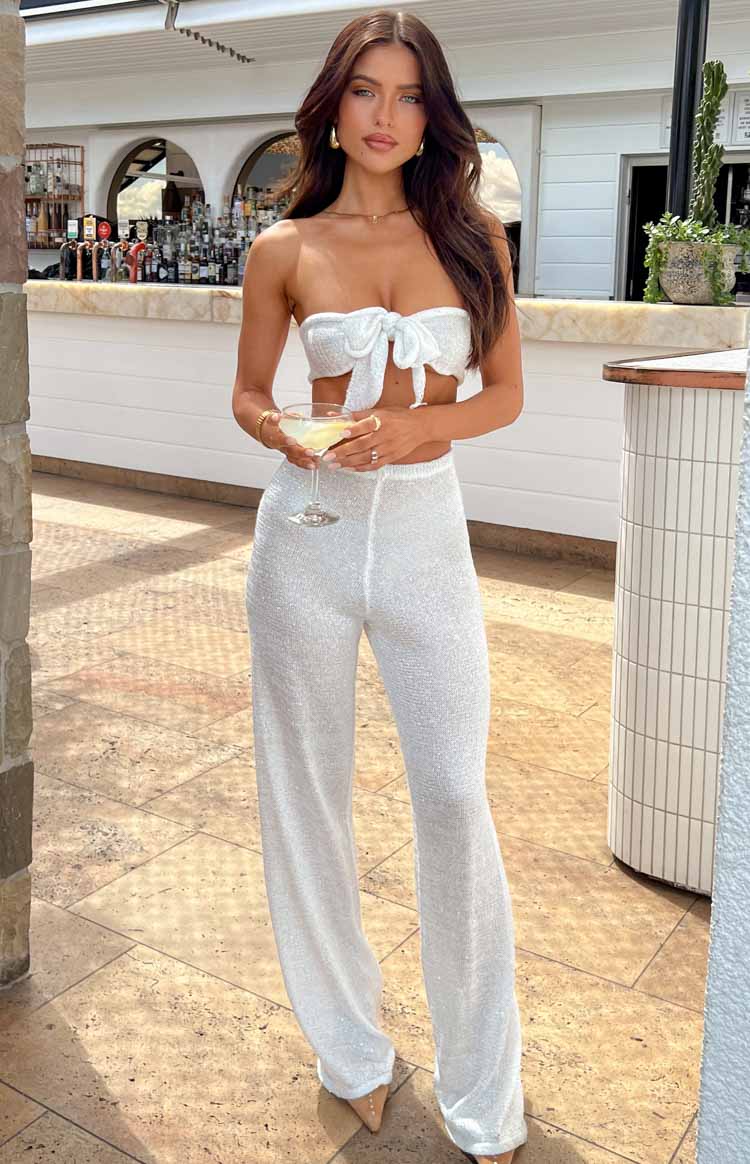 Full length white sequin knit wide-leg pants with a relaxed fit and shimmering texture