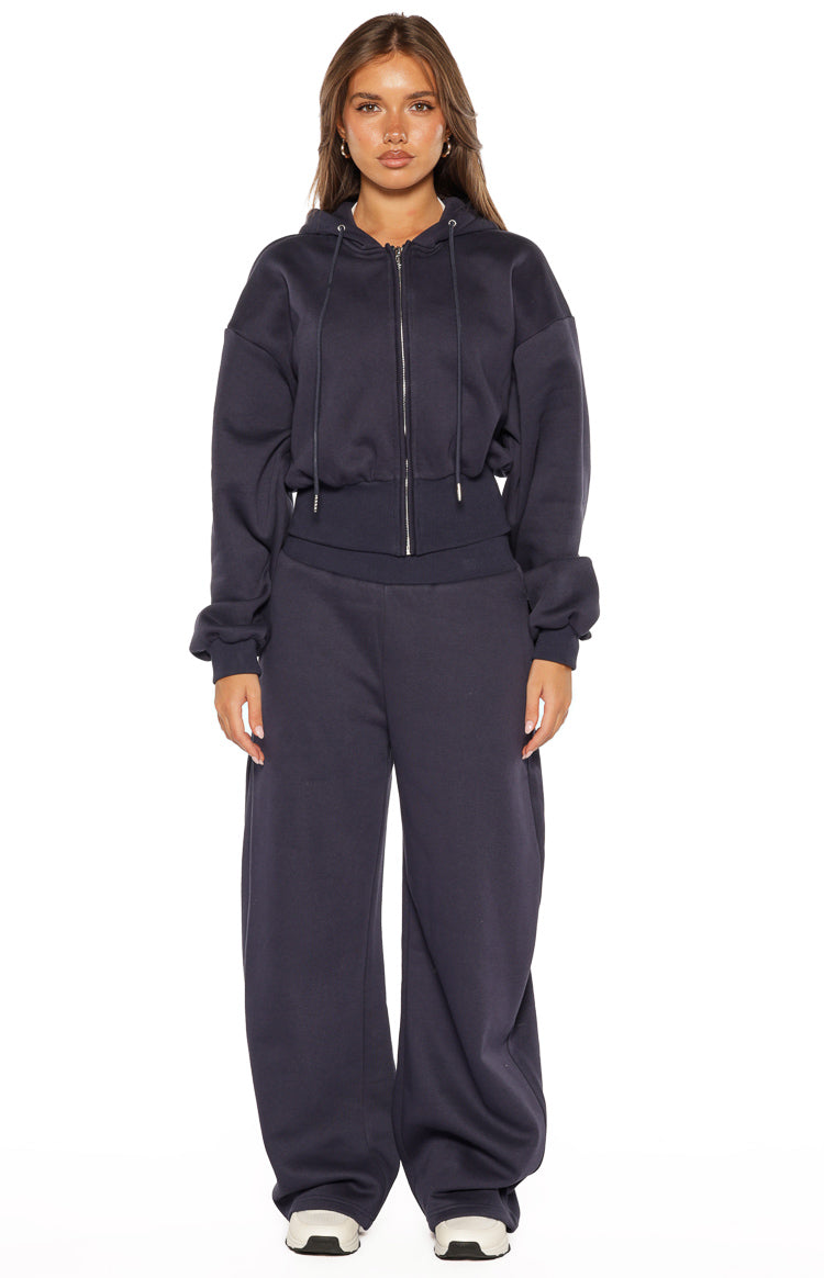 Navy full zip hoodie sweater with a relaxed fit, drawstring hood, and cropped ribbed hem