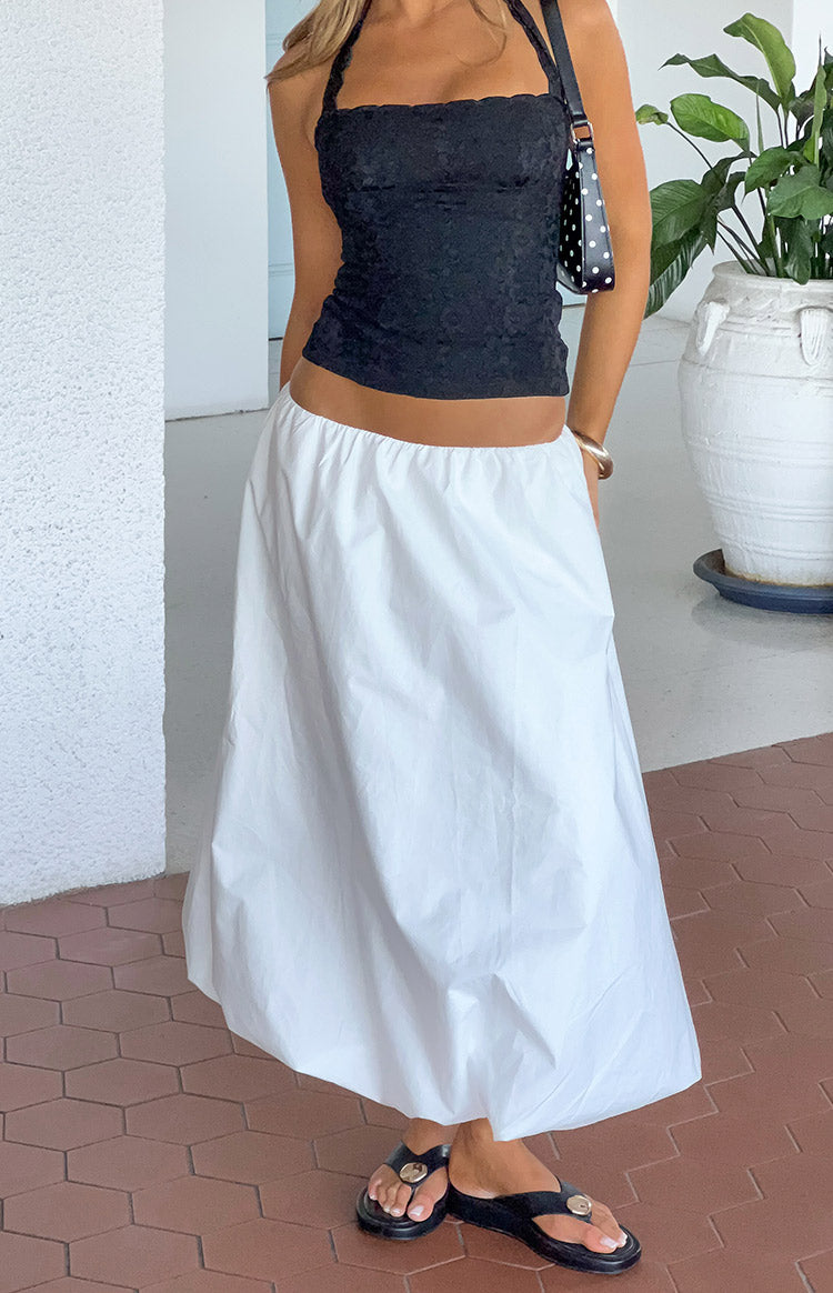 White bubble hem skirt with a gathered elastic waist and voluminous, rounded silhouette