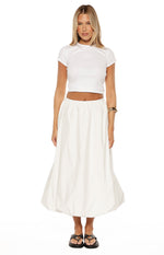 Front view of a white bubble hem midi skirt with an elasticated waist and voluminous fabric
