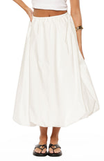 Front view of a white skirt featuring a gathered elasticated waist and a voluminous bubble hem