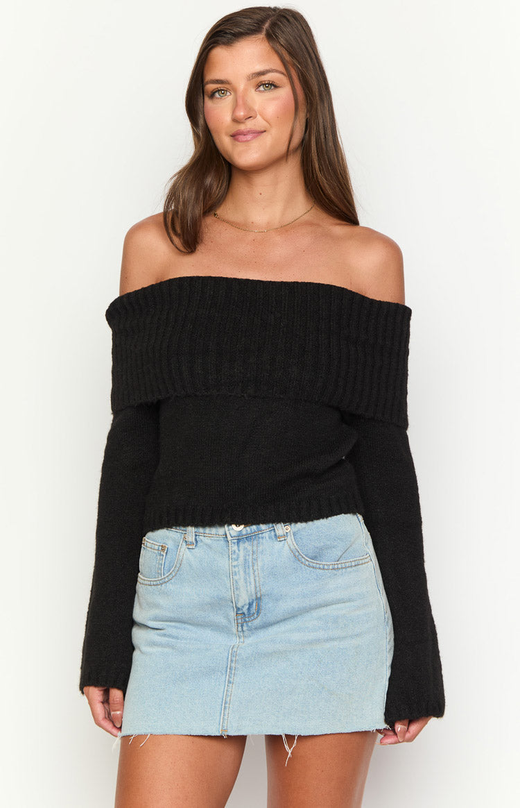 Black off-shoulder knit sweater with a wide ribbed fold-over neckline and long sleeves