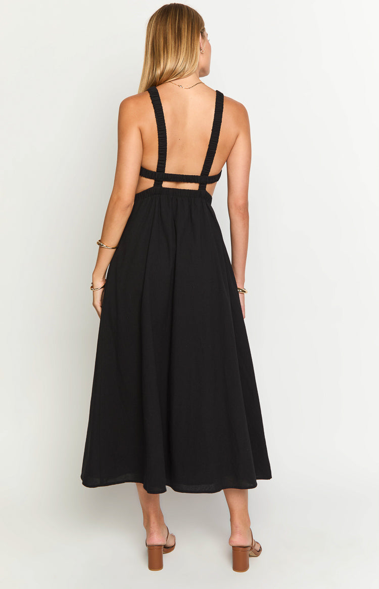 Rear view of a black backless midi dress with wide ruched straps, elasticated waist, and side cutouts