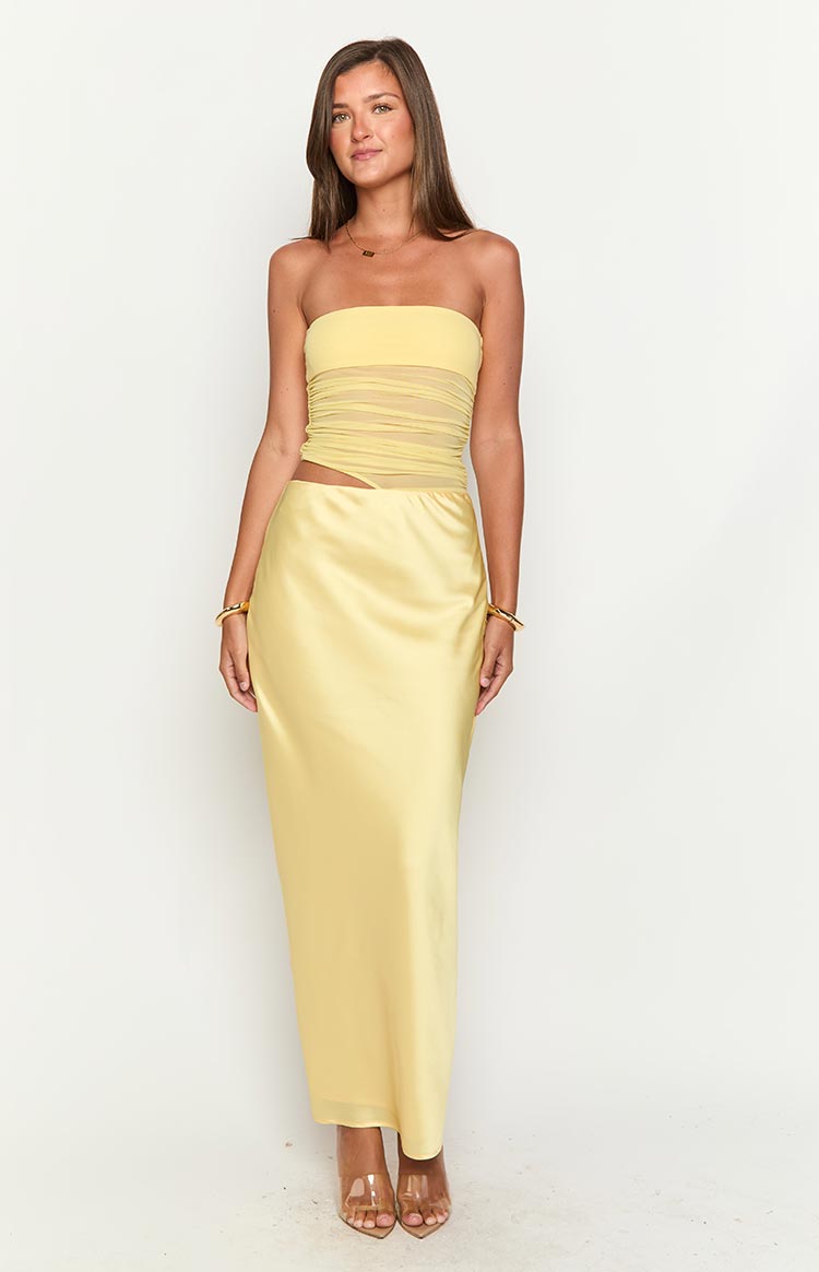 Strapless yellow maxi dress featuring a ruched mesh bandeau bodice and a side cutout at the waist