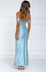 Rear view of a light blue satin off-shoulder maxi dress with a low scoop back and flowing skirt