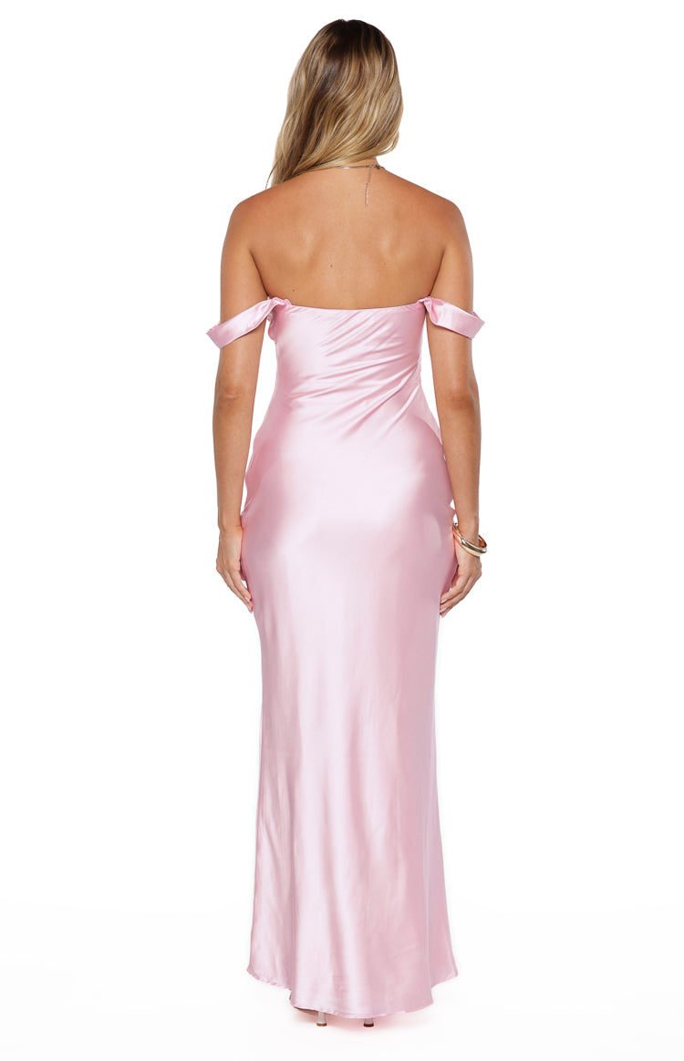 Rear view of a light pink satin off-shoulder maxi dress with a straight back and a fitted, flowing silhouette