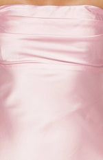 Close-up of the light pink satin fabric with subtle ruching detail on the bodice of the maxi dress