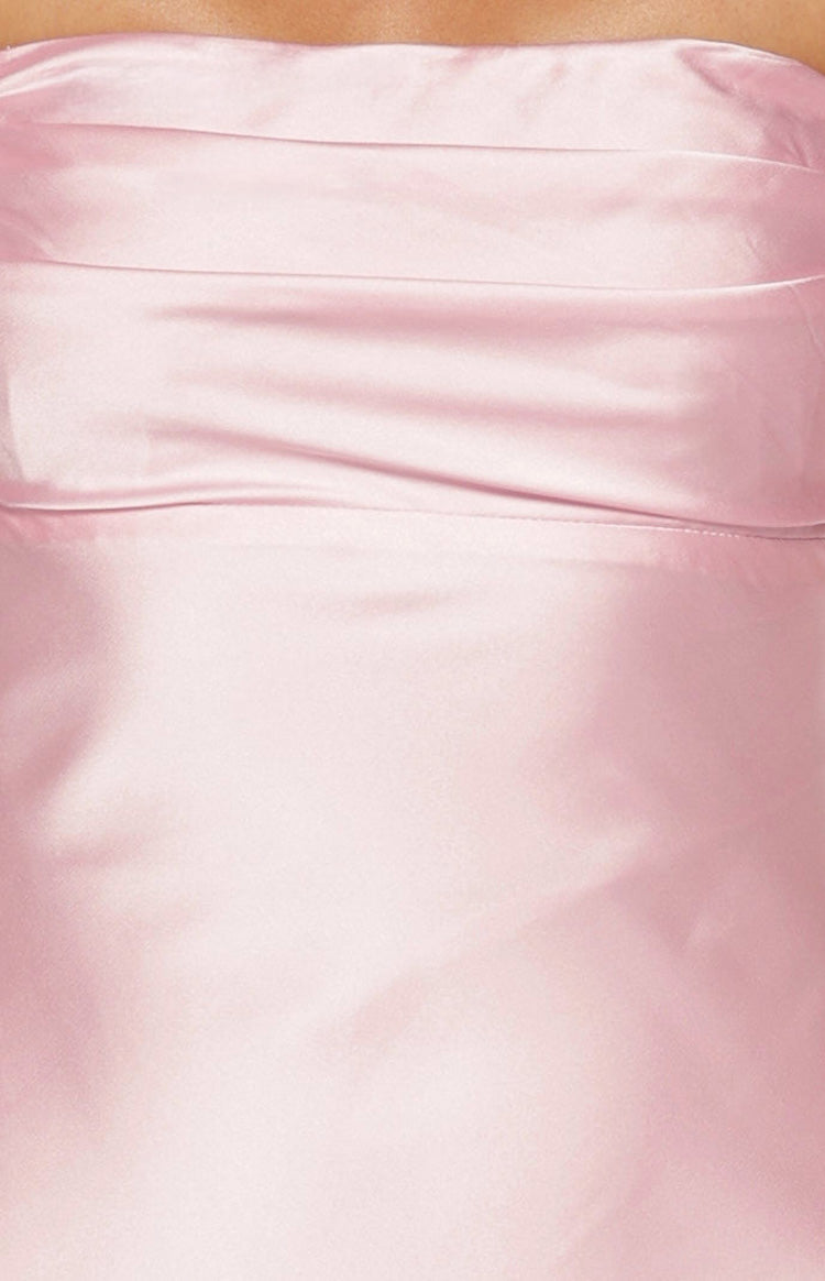 Close-up of the light pink satin fabric with subtle ruching detail on the bodice of the maxi dress