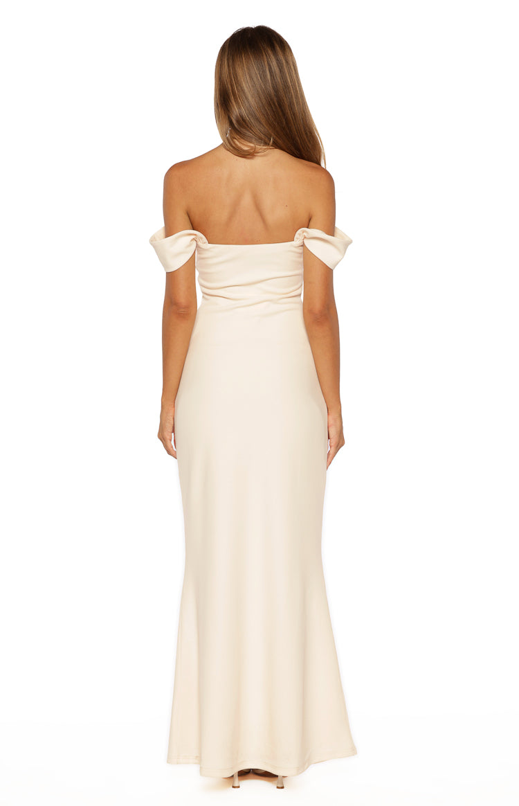 Rear view of a cream crepe formal maxi dress with off-shoulder sleeves and a fitted silhouette