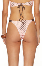 Back view of cheeky pink swim bottoms with brown spots and binding essential for a Summer Swim