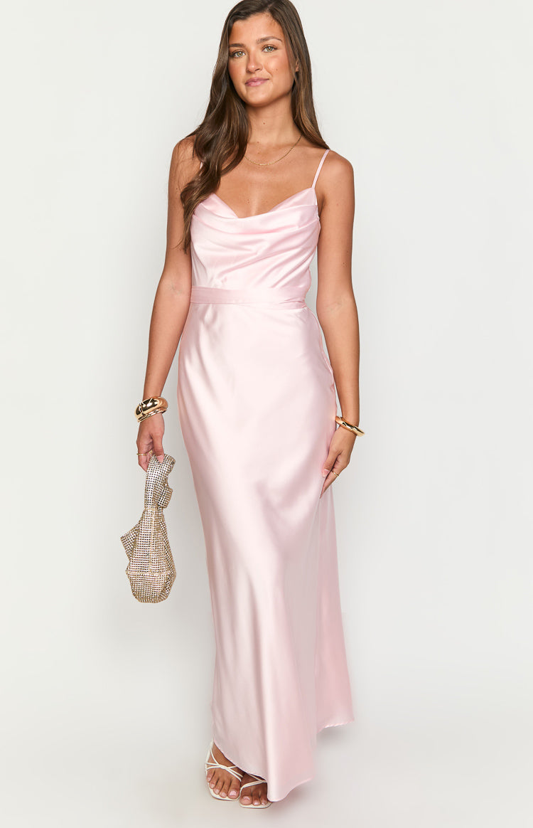 Pink satin maxi dress with a draped cowl neckline, delicate spaghetti straps, and a fitted waist