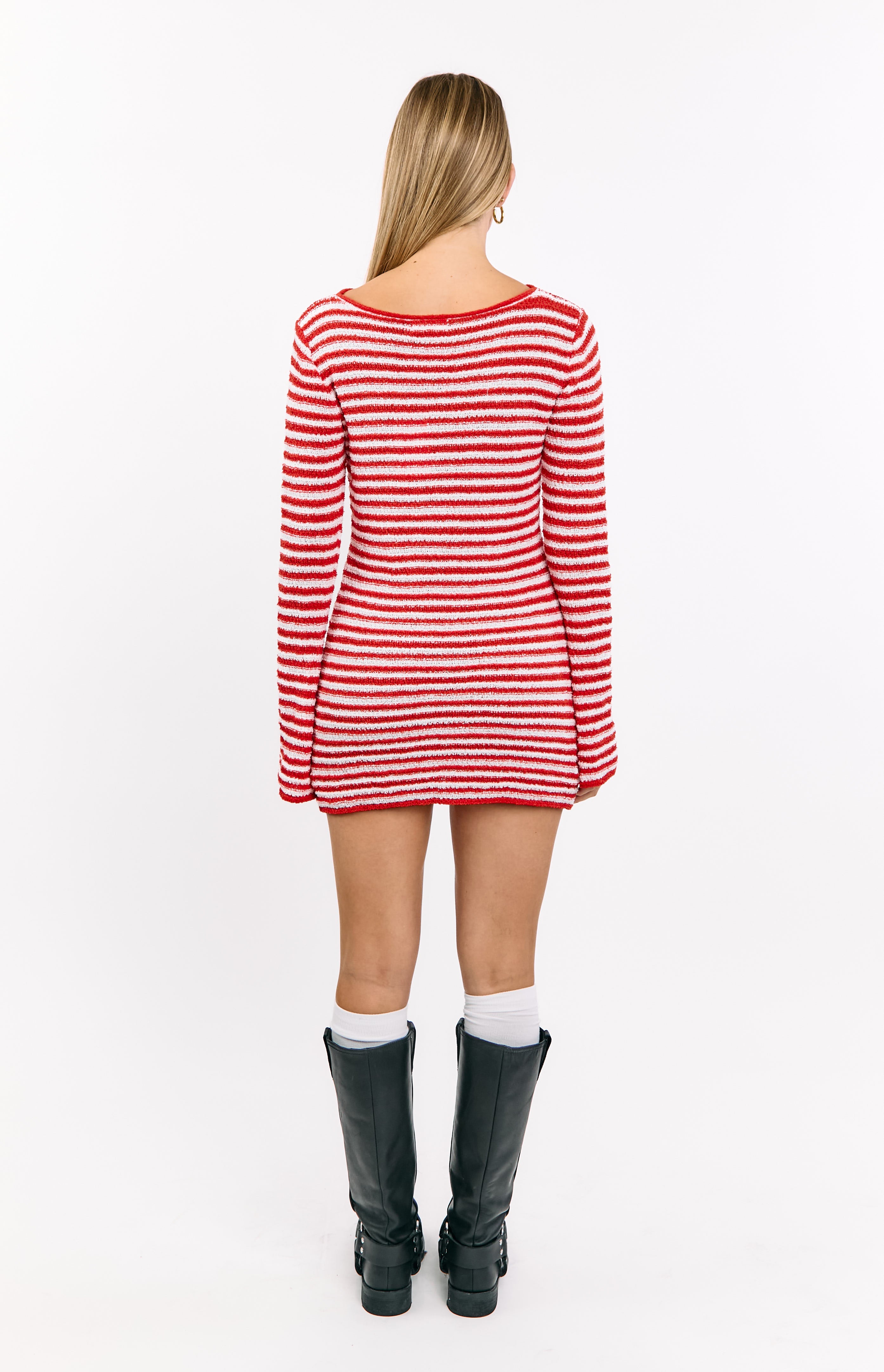 Rear view of the red and white striped knit mini dress with long sleeves and a scoop back