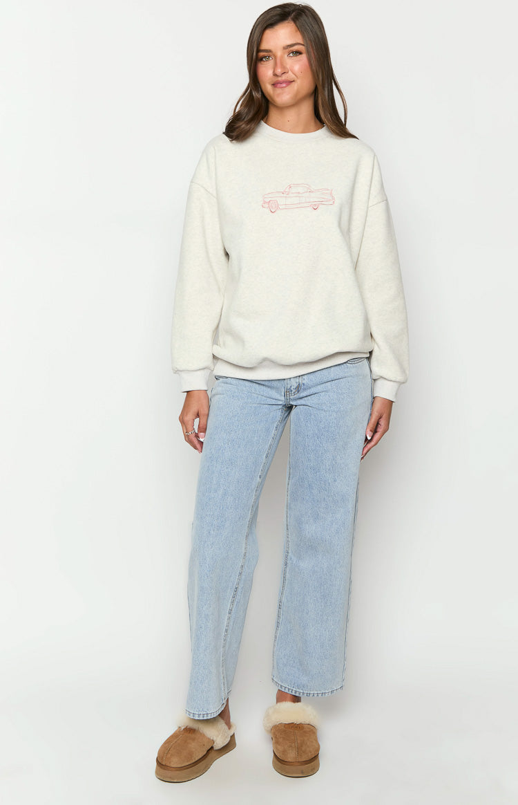 Front view of a grey crew neck sweater with a red outline car graphic on the chest, relaxed fit