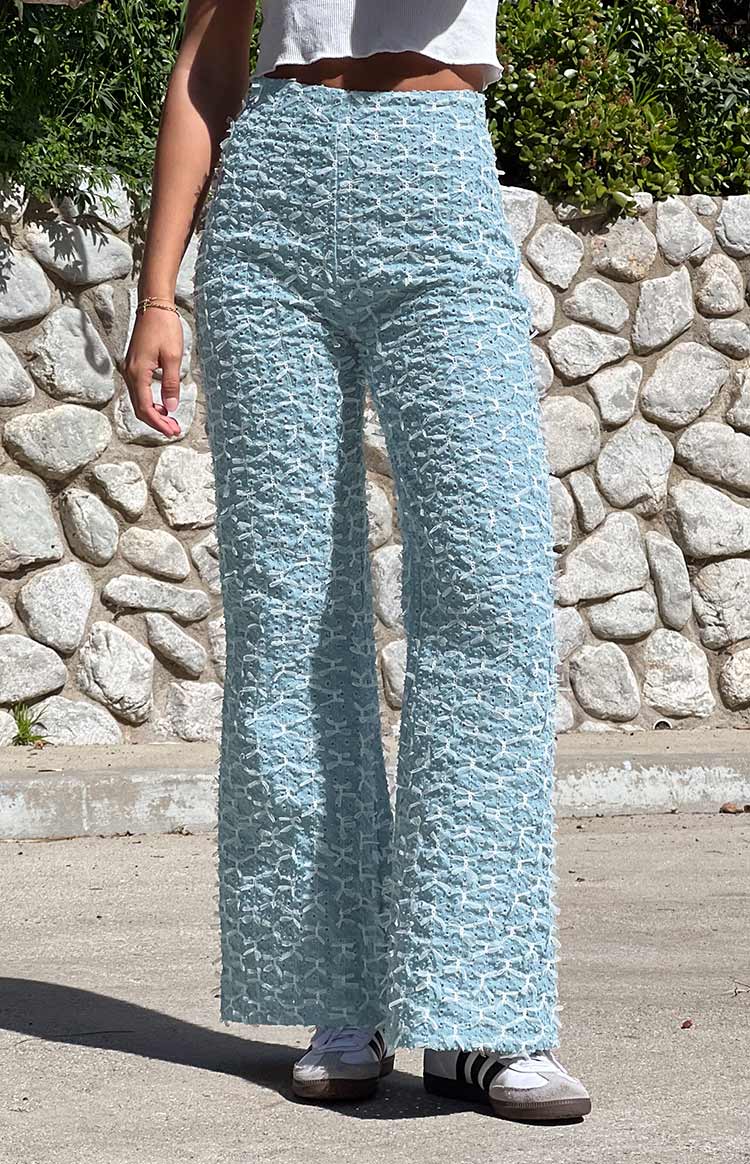 Blue chambray flared jeans featuring an all-over textured woven pattern and wide leg