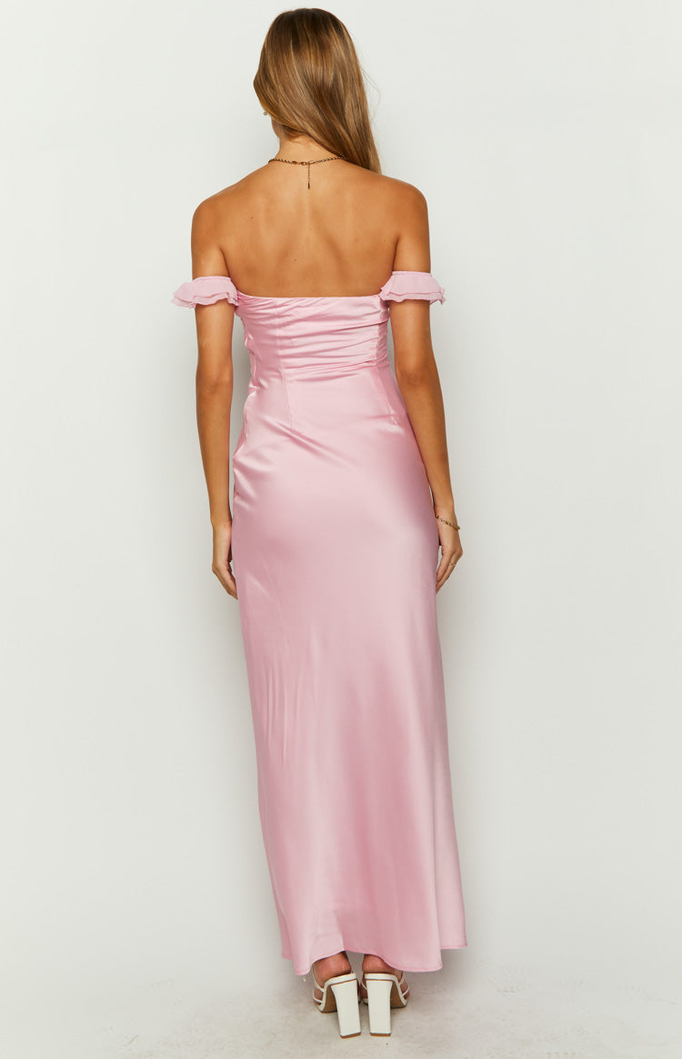 Rear view of a pink satin maxi dress with off-shoulder ruffled sleeves and a ruched back bodice