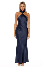 Front view of a navy satin maxi dress featuring a twisted halter neckline and a sleek, flowing silhouette