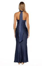 Rear view of a navy satin maxi dress showing the halter neck tie and low back