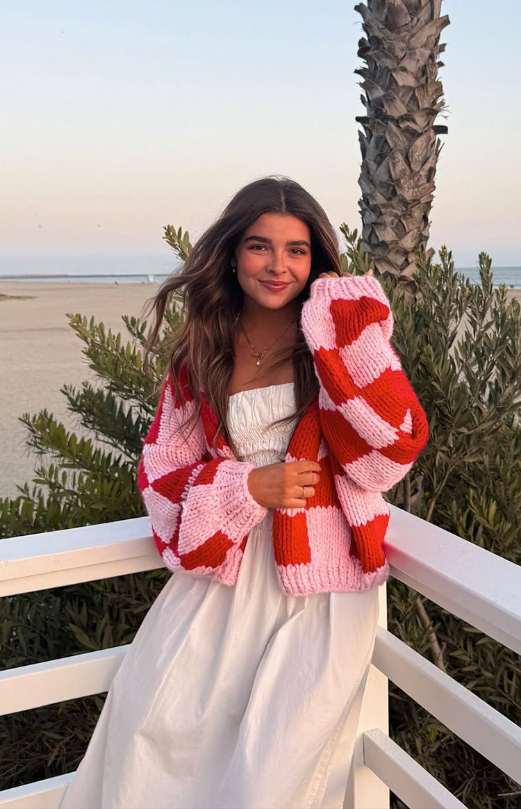 Beginning Boutique Envi Pink And Red Checkered Knit Cardigan pink and red checkered chunky knit open cardigan with long sleeves