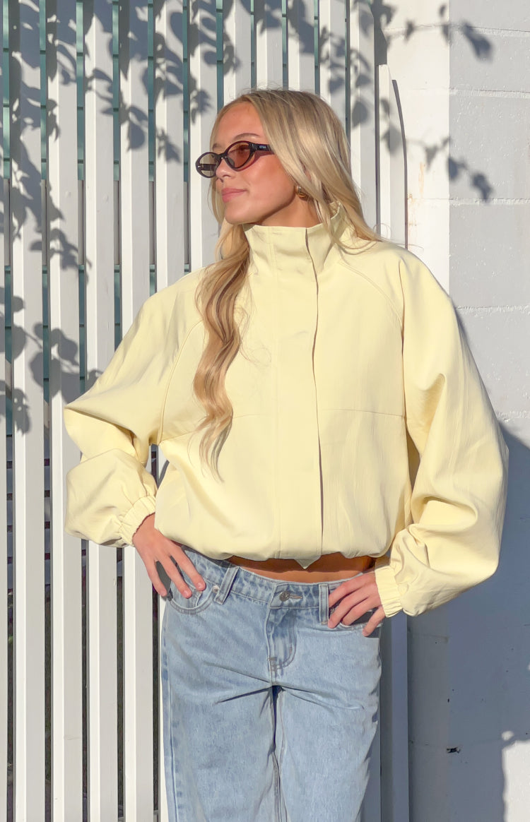 Beginning Boutique Enya Yellow Funnel Neck Sports Jacket pale yellow funnel neck sports jacket with raglan sleeves, elasticat