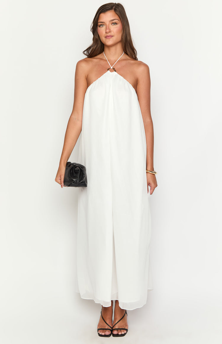 White flowy maxi dress with a halter neckline and a central ring detail