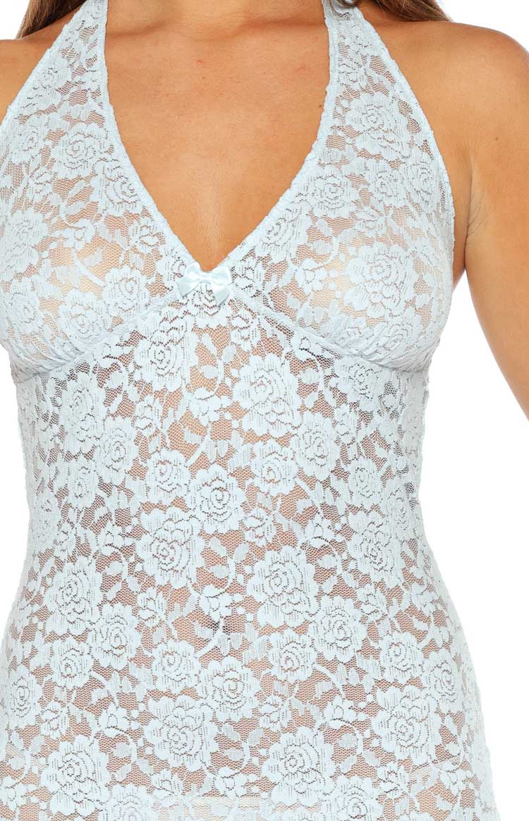 Close-up of the pale blue sheer floral lace mini dress with a V-neck halter and small satin bow detail
