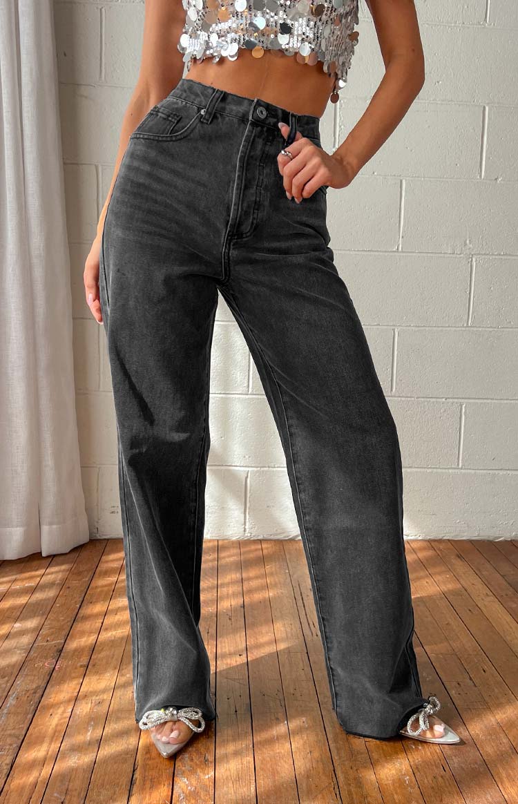 Full length view of black straight leg jeans with a high waist and faded wash