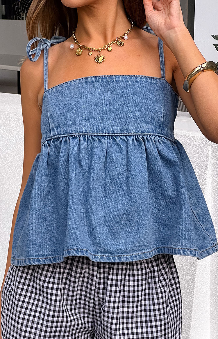 Beginning Boutique Ethel Blue Denim Top blue denim square neck top with tie shoulder straps and gathered peplum hem