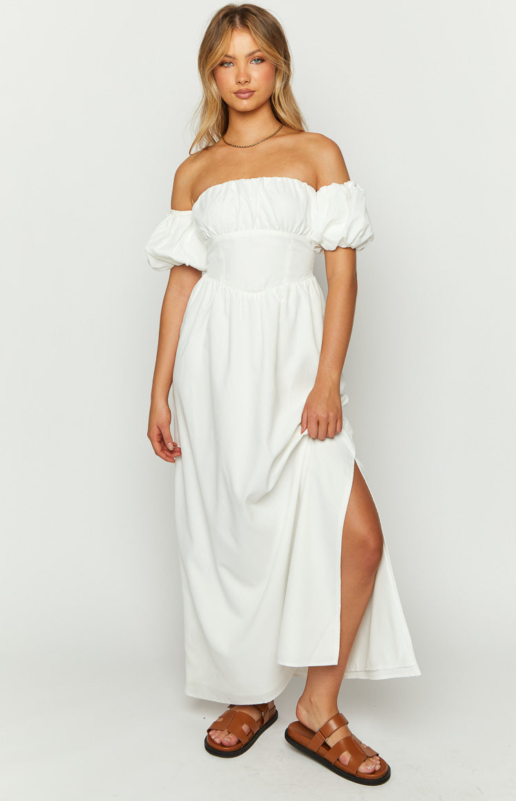 White off-the-shoulder maxi dress with ruched bust, fitted bodice, puff sleeves, and a high side split