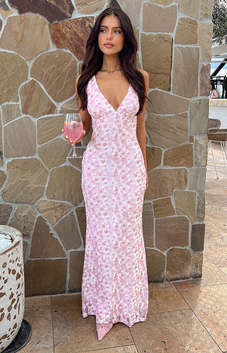 Full-length front view of a pink lace maxi dress with a V-neckline and textured floral lace overlay