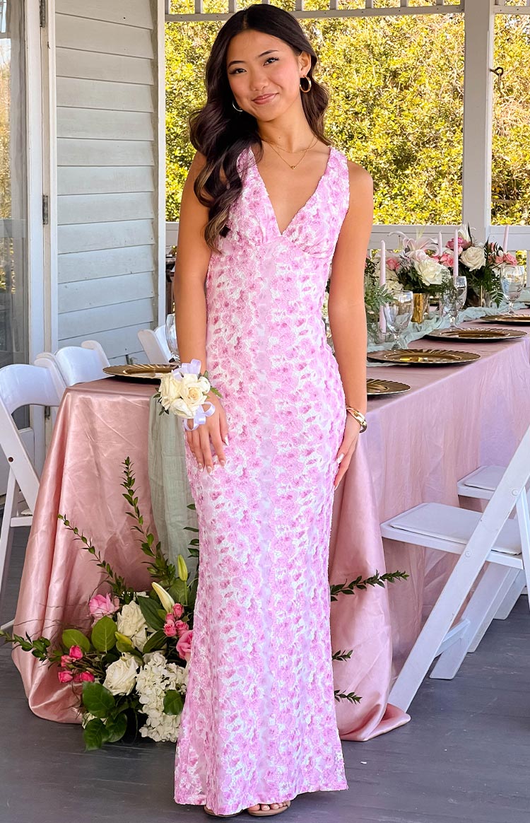 Full length front view of a pink and white lace V-neck sleeveless maxi dress with a fitted bodice