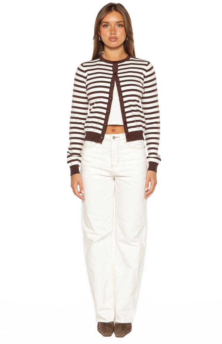 Front view of white wide-leg denim jeans with contrast stitching and a raw hem