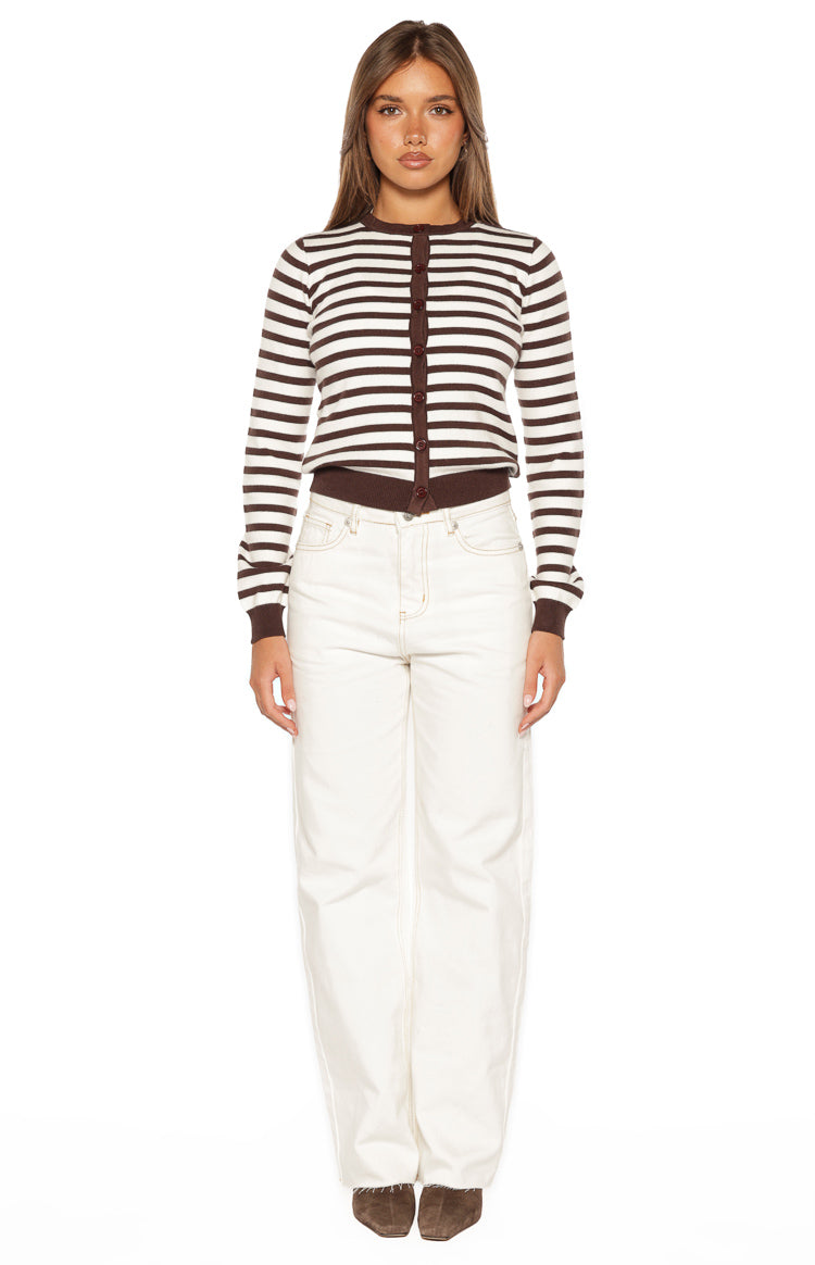 Front view of white wide-leg denim jeans with contrast stitching and a raw hem