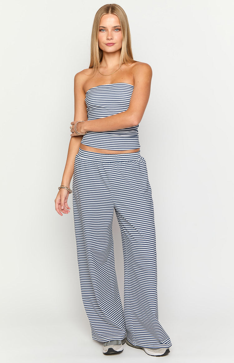 Full length view of navy and white striped wide leg pants with an elasticated waistband