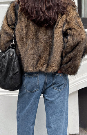 Beginning Boutique Fran Eyelet Mid Wash Pocket Jeans mid wash blue denim jeans with back pockets and eyelet detail on the waistband