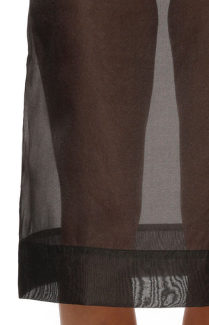 Close-up of the black sheer organza midi skirt hem with a wide opaque band