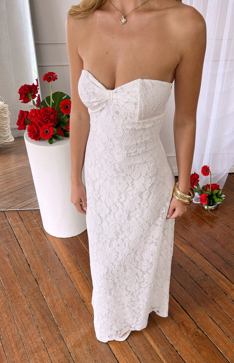 White lace strapless maxi dress with a sweetheart neckline and a small bow detail on the bust