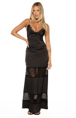 Black satin maxi dress featuring a V-neckline with lace trim and two distinct tiers of sheer lace panels on the lower skirt